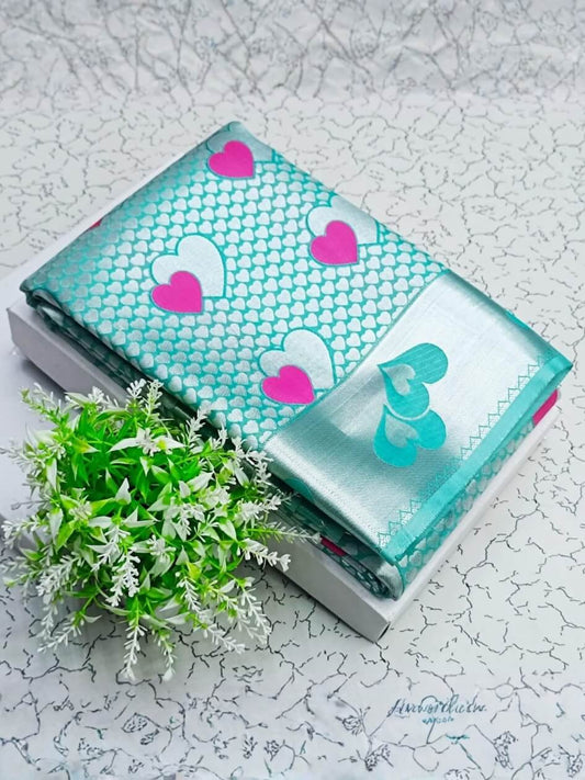 Flaunt Sea Green Soft Banarasi Silk Saree With Ornate Blouse Piece