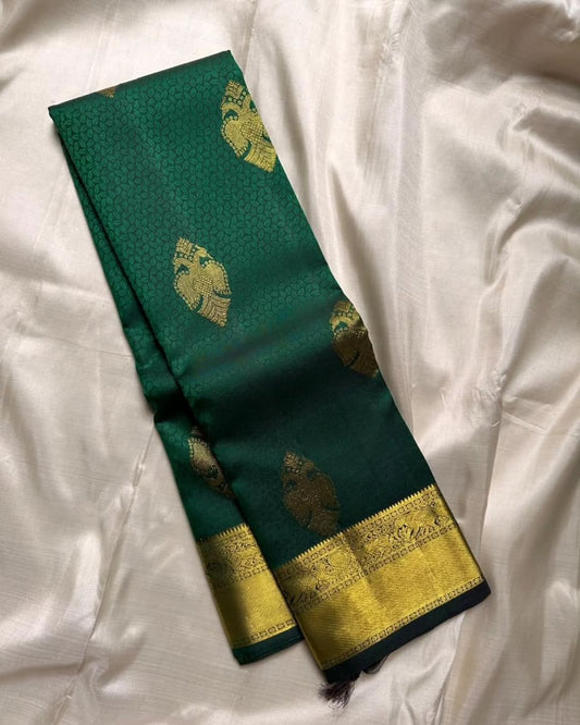 Engaging Dark Green Soft Banarasi Silk Saree With Charismatic Blouse Piece