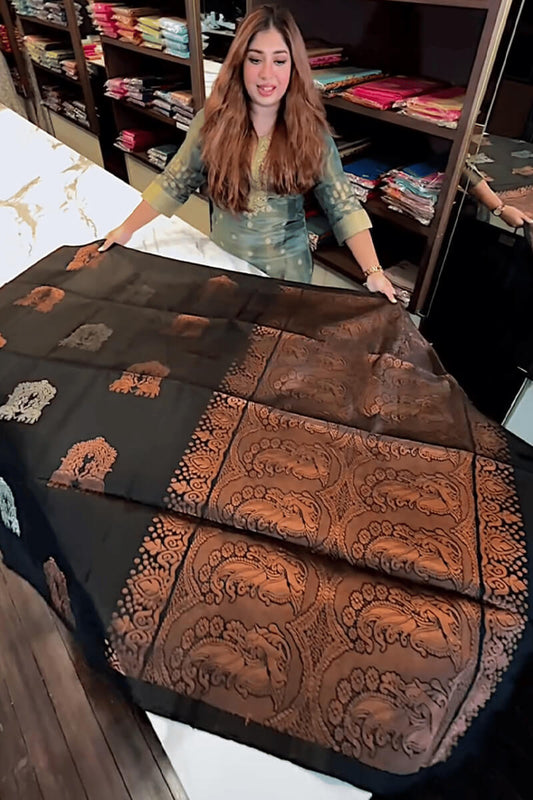 Adorning Black Soft Banarasi Silk Saree With Profuse Blouse Piece