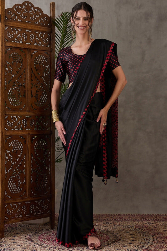 Super classy Black Ajrakh Printed Semi Modal Silk Saree With Demanding Blouse Piece