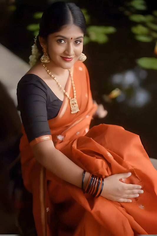 Evocative Orange Cotton Silk Saree With Eclat Blouse Piece