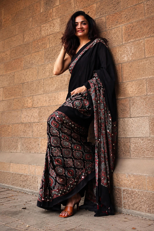 Skinny Black Ajrakh Printed Mirror Work Satin Silk Saree With Amiable Blouse Piece