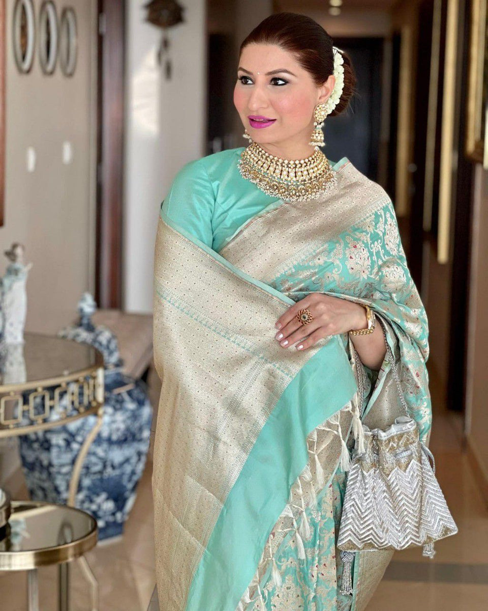 Sea Green Woven Design Silk Blend Saree With Unstitched Blouse Piece