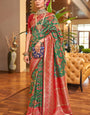 Bucolic Dark Green Patola Silk Saree with Efflorescence Blouse Piece