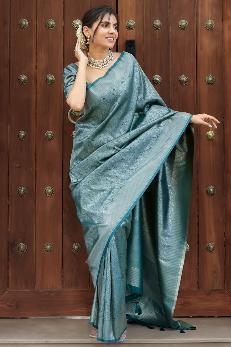 Exquisite Rama Soft Silk Saree With Unequalled Blouse Piece