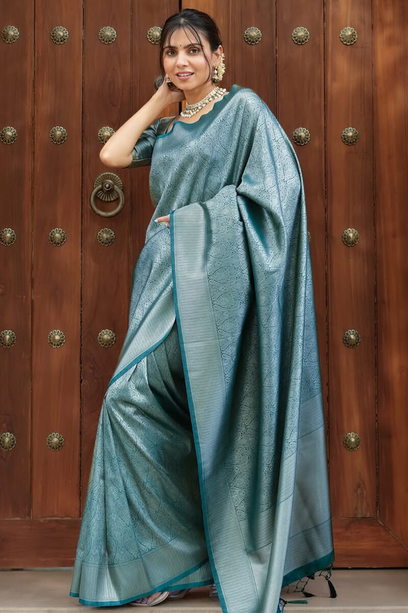 Exquisite Rama Soft Silk Saree With Unequalled Blouse Piece