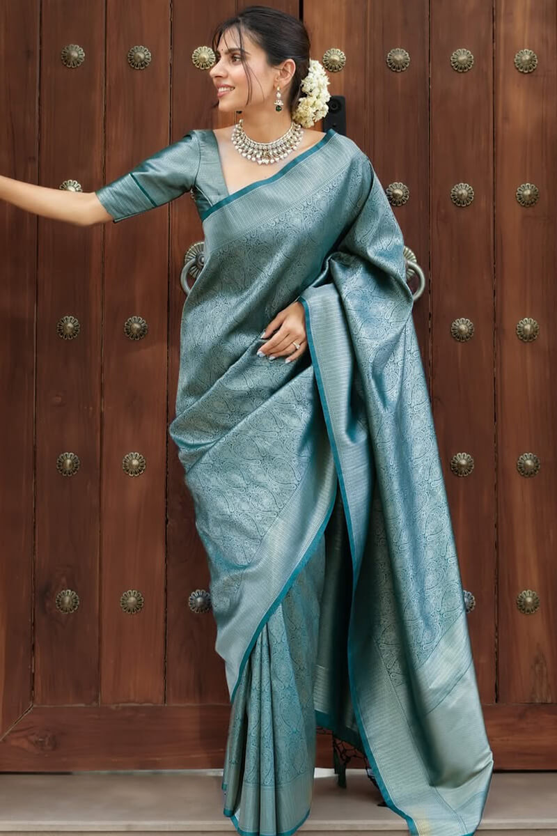 Exquisite Rama Soft Silk Saree With Unequalled Blouse Piece
