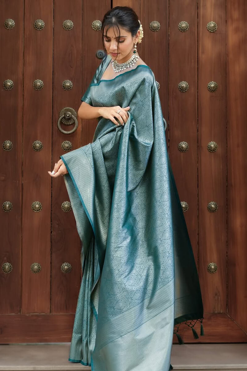 Exquisite Rama Soft Silk Saree With Unequalled Blouse Piece