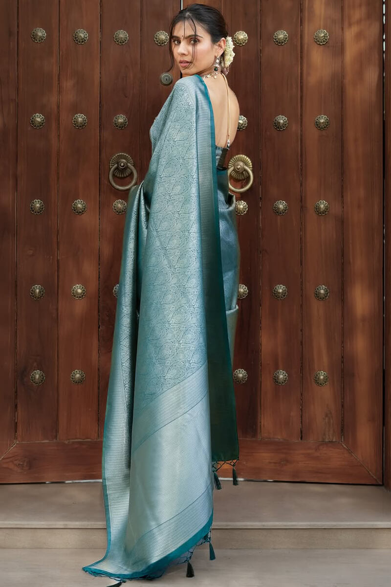 Exquisite Rama Soft Silk Saree With Unequalled Blouse Piece