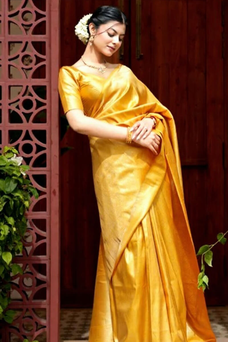 Jubilant Yellow Soft Silk Saree With Adoring Blouse Piece
