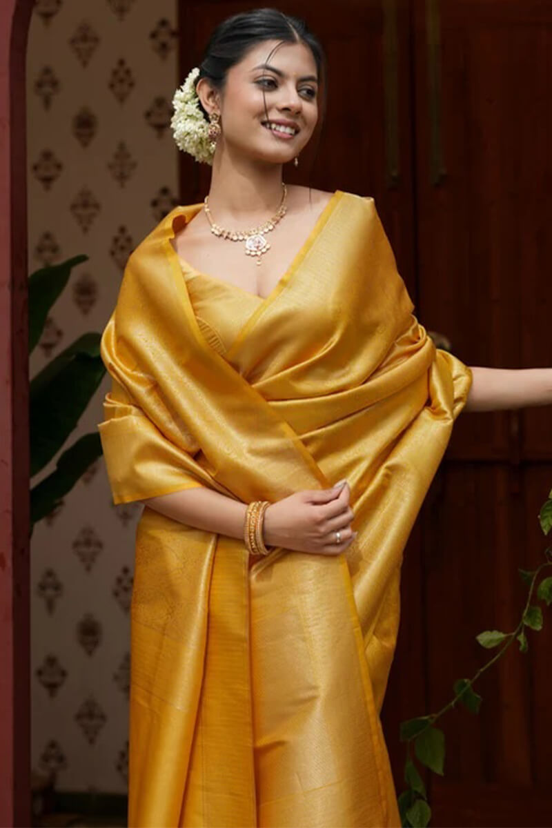 Jubilant Yellow Soft Silk Saree With Adoring Blouse Piece