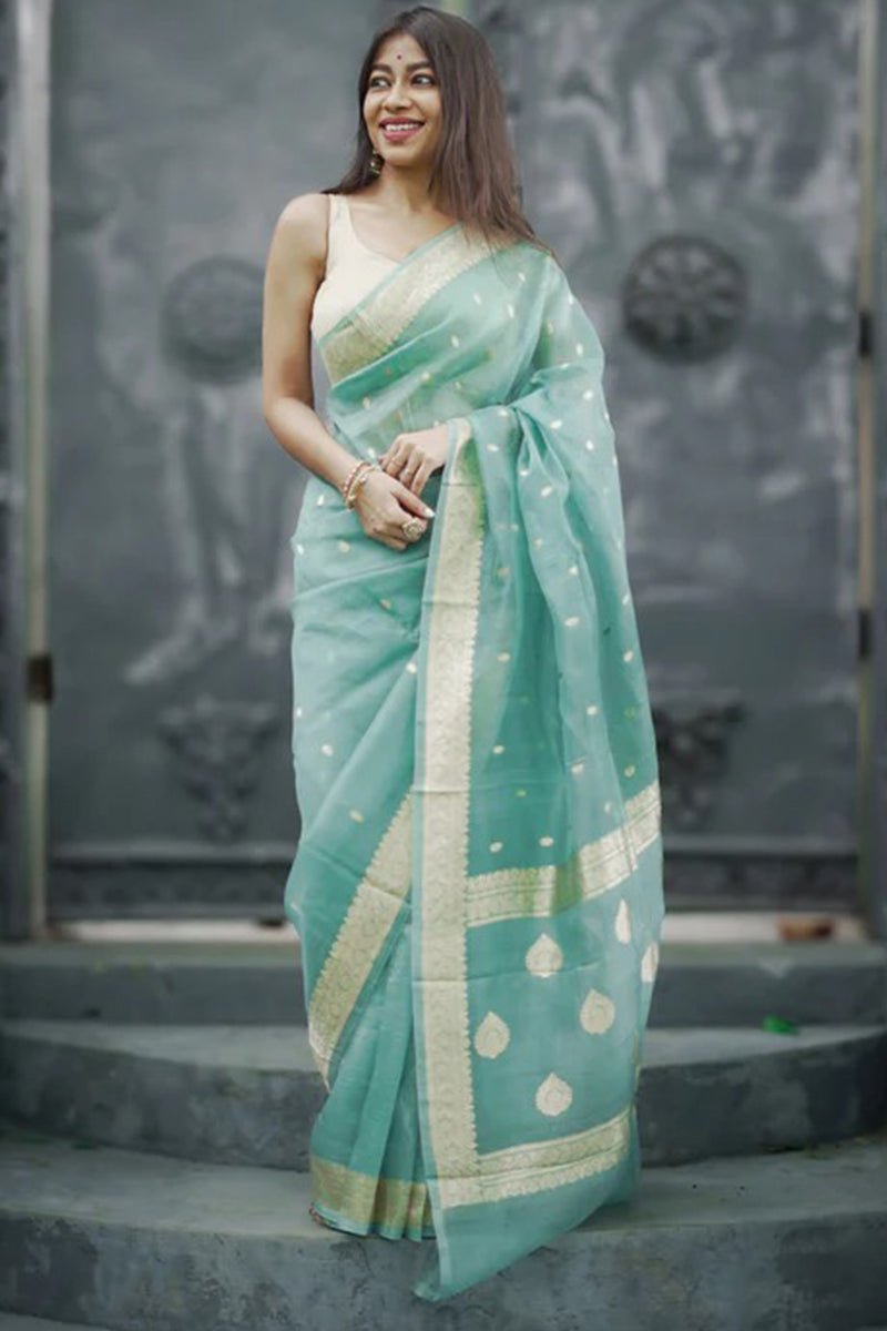 Ebullience Turquoise Linen Silk Saree With Bewitching Blouse Piece