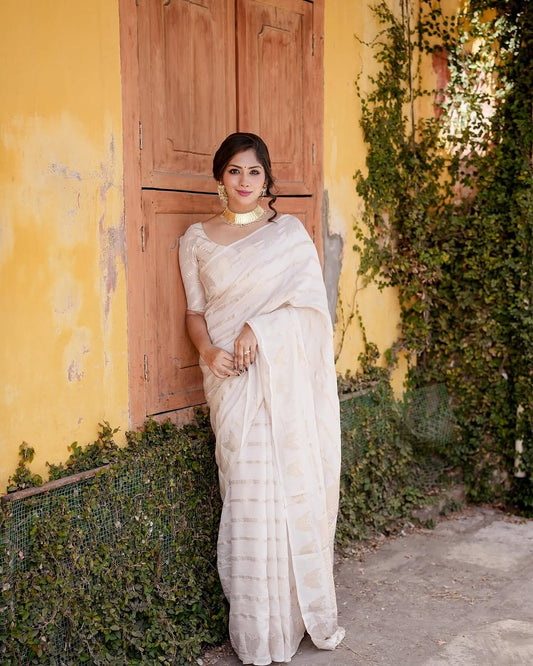 Luminous Off White Soft Silk Saree With Capricious Blouse Piece