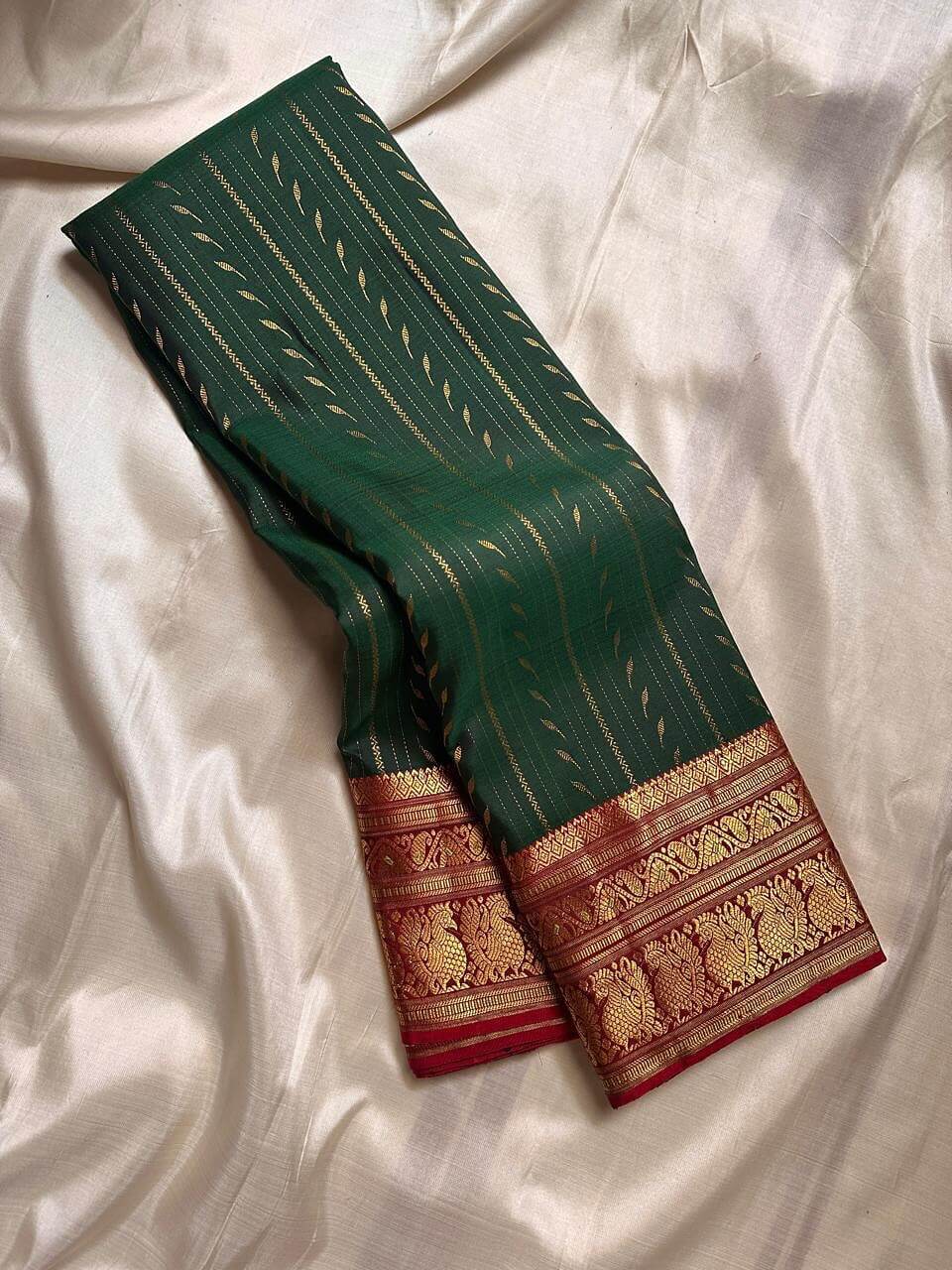 Bewitching Dark Green Soft Silk Saree With Lustrous Blouse Piece