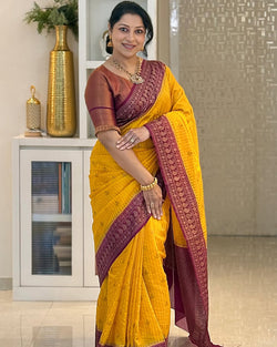 Surpassing Yellow Soft Silk Saree With Gleaming Blouse Piece