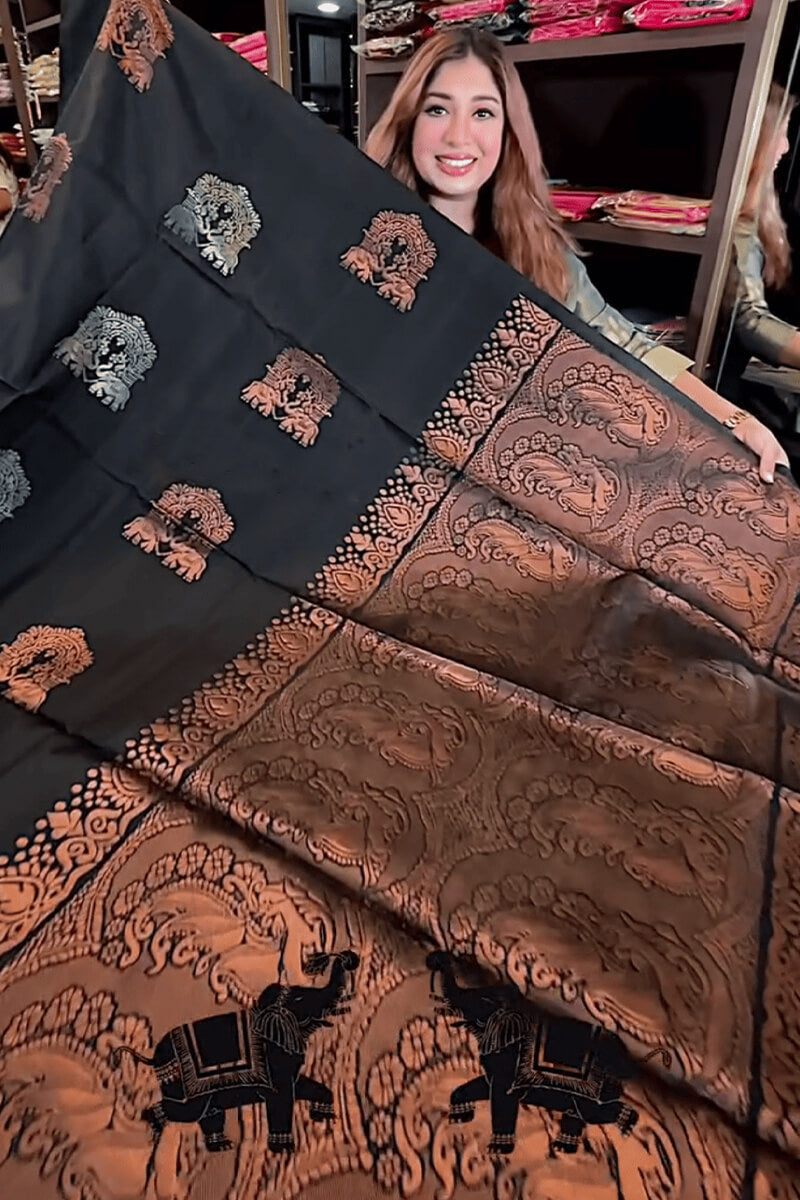 Adorning Black Soft Banarasi Silk Saree With Profuse Blouse Piece