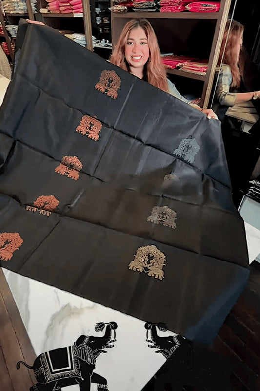 Adorning Black Soft Banarasi Silk Saree With Profuse Blouse Piece