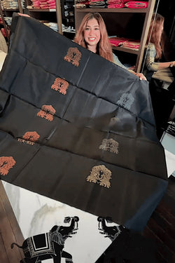 Adorning Black Soft Banarasi Silk Saree With Profuse Blouse Piece