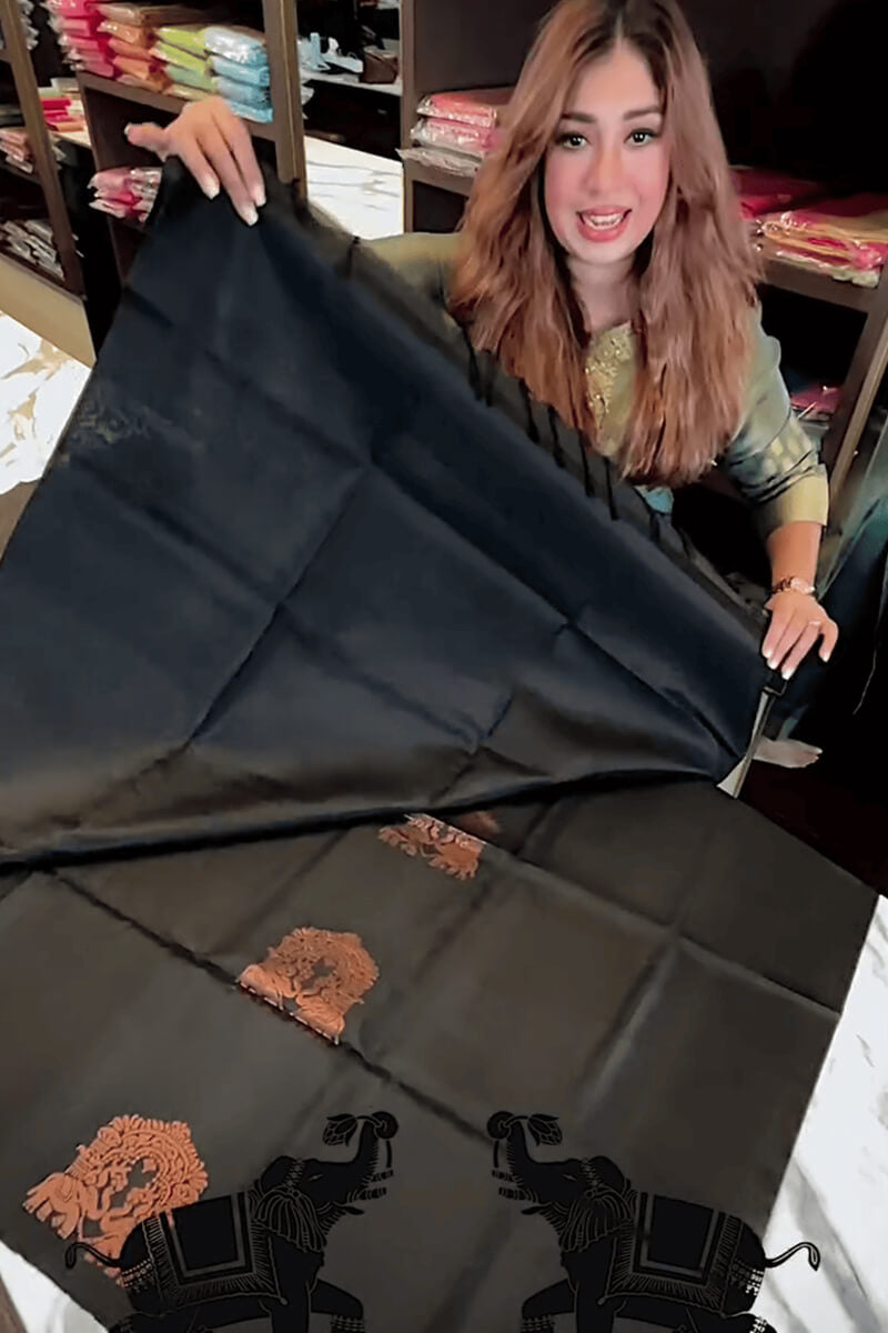 Adorning Black Soft Banarasi Silk Saree With Profuse Blouse Piece