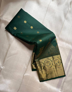 Prominent Dark Green Pure Zari Weaving Banarasi Silk Saree With Innovative Blouse Piece