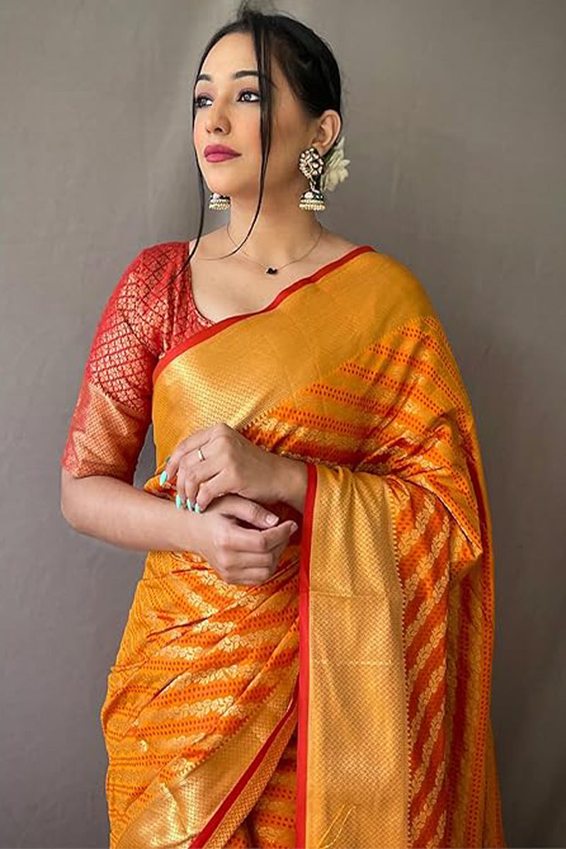Cynosure Mustard Soft Banarasi Silk Saree With Prettiest Blouse Piece