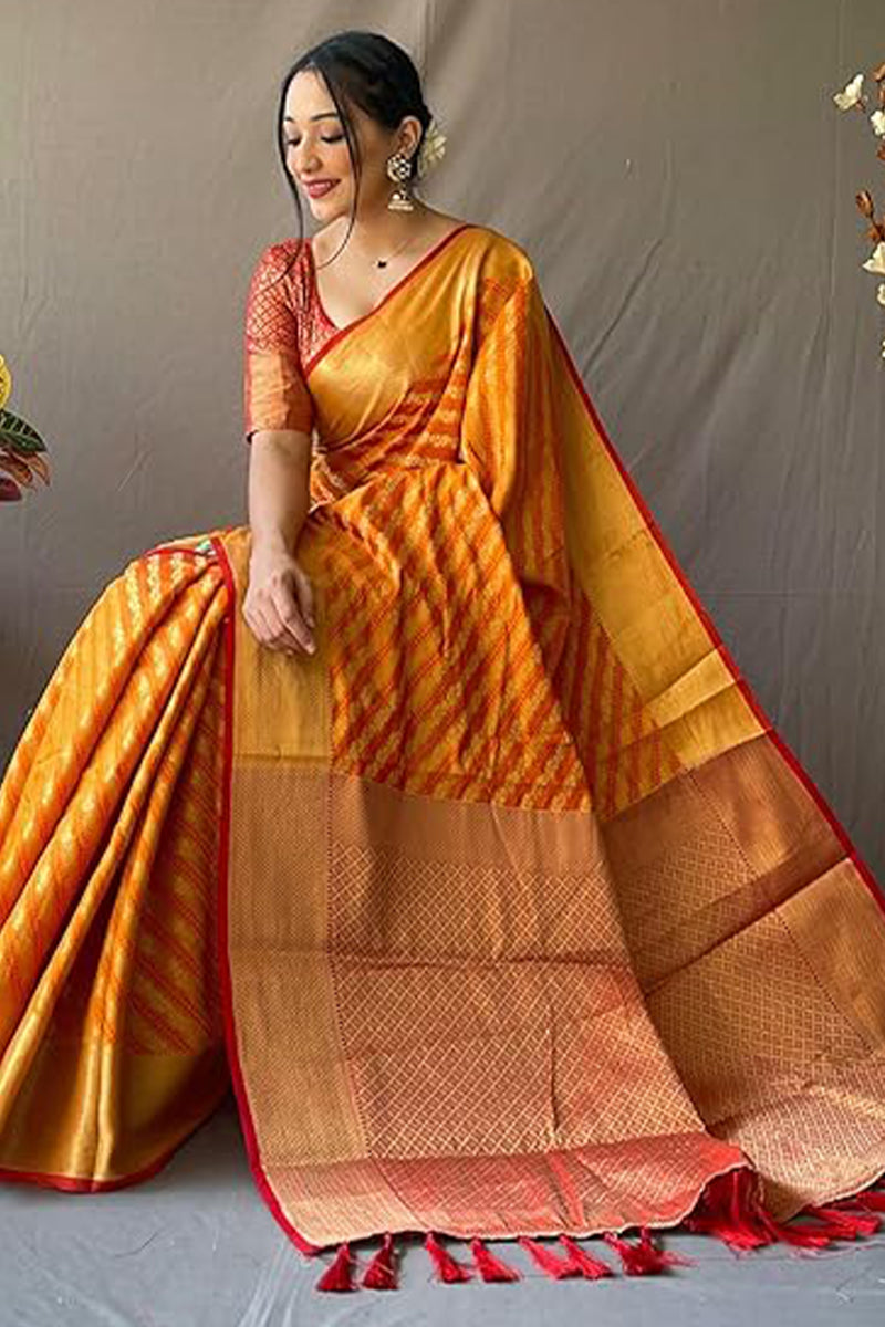 Cynosure Mustard Soft Banarasi Silk Saree With Prettiest Blouse Piece