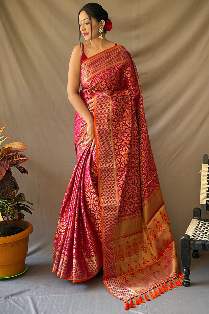 Adoring Dark Pink Patola Silk Saree with Exemplary Blouse Piece