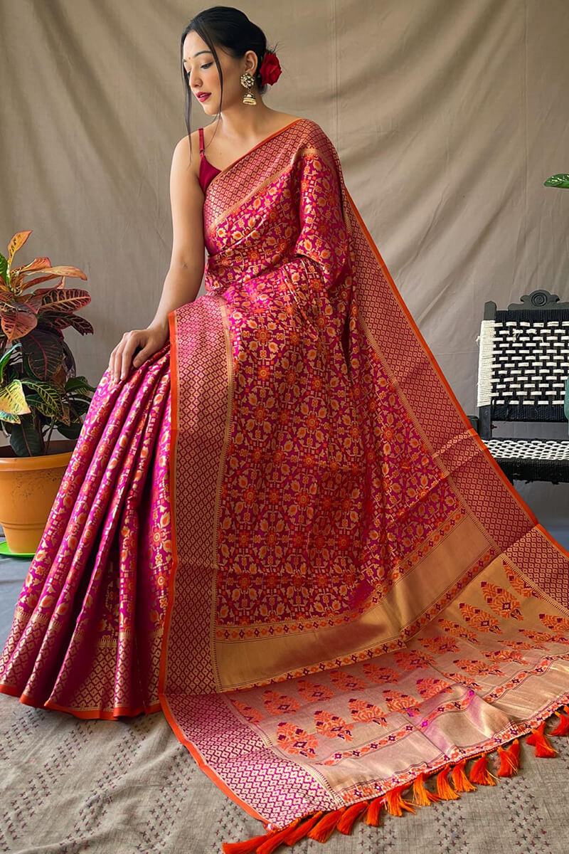 Adoring Dark Pink Patola Silk Saree with Exemplary Blouse Piece