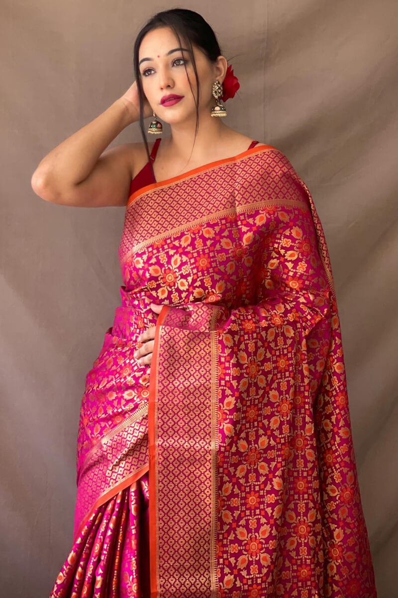 Adoring Dark Pink Patola Silk Saree with Exemplary Blouse Piece