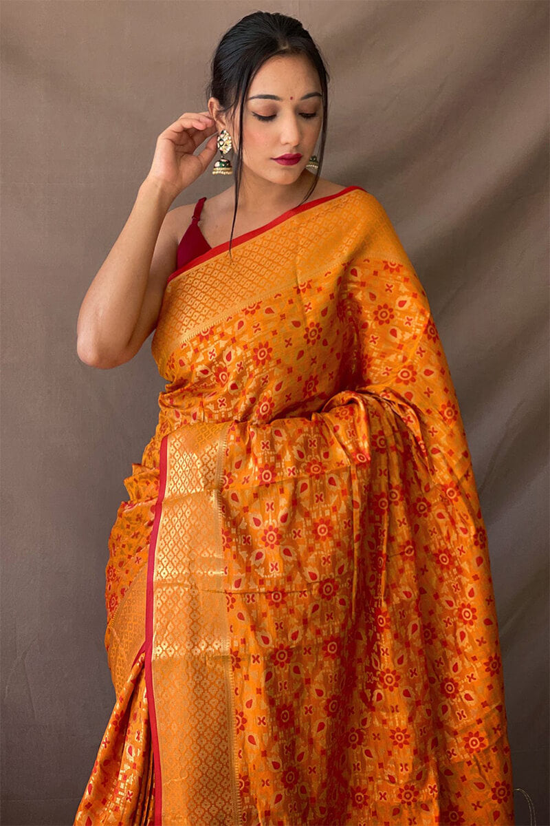 Pleasurable Mustard Patola Silk Saree with Sumptuous Blouse Piece