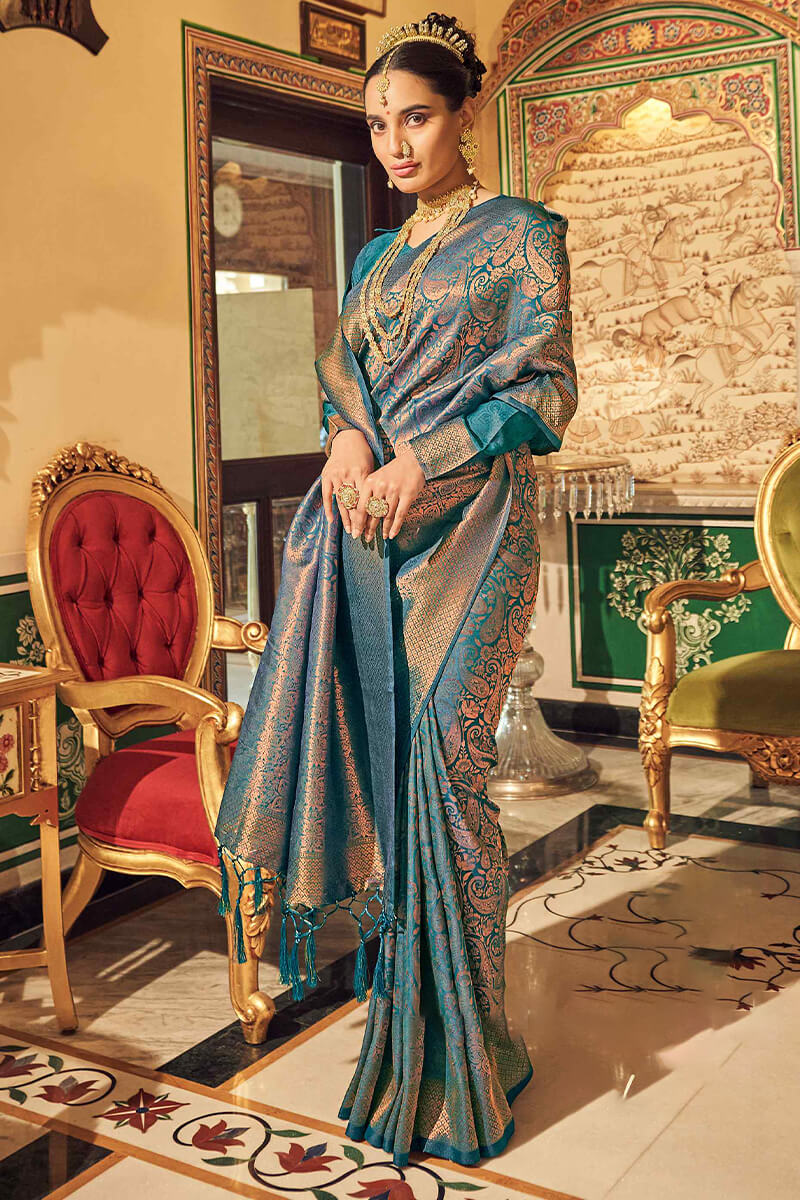 Entrancing Rama Kanjivaram Silk Saree With Fairytale Blouse Piece