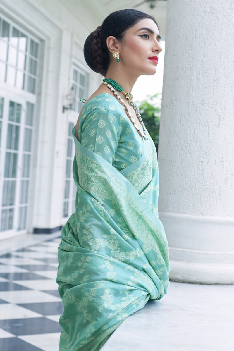 Nemesi Turquoise Lucknowi Silk Saree and Inspiring Blouse Piece