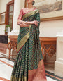 Cynosure Dark Green Soft Patola Silk Saree with Ethereal Blouse Piece