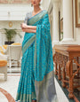 Mellifluous Firozi Soft Patola Silk Saree with Tantalizing Blouse Piece