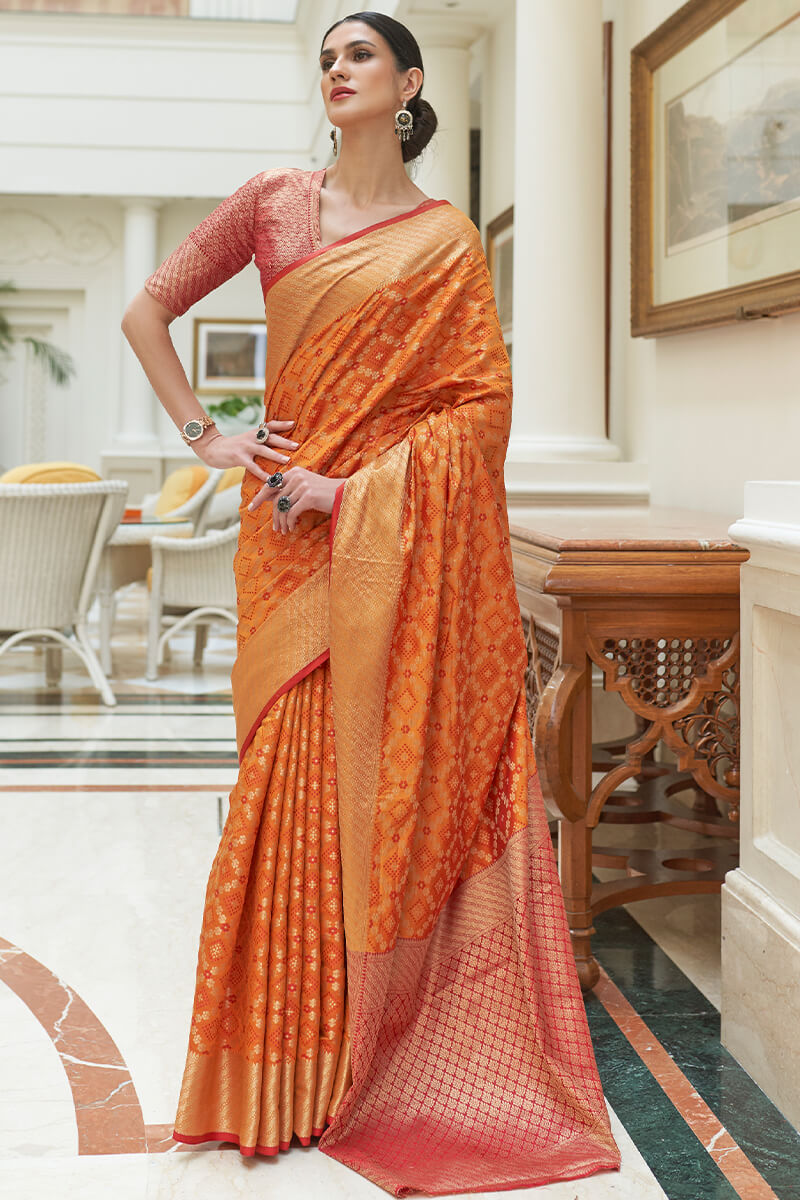 Eclat Orange Soft Patola Silk Saree with Nebula Blouse Piece