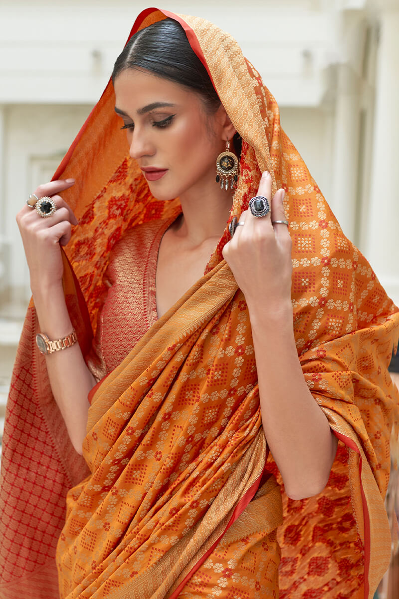 Eclat Orange Soft Patola Silk Saree with Nebula Blouse Piece