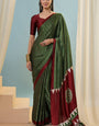 Designer Dark Green Ajrakh Printed Semi Modal Silk Saree With Scintillating Blouse Piece