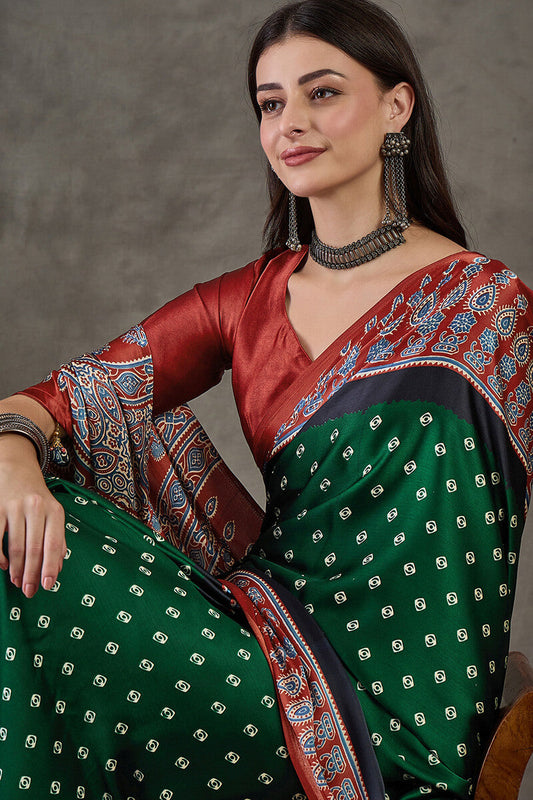 Mellifluous Dark Green Ajrakh Printed Semi Modal Silk Saree With Embellished Blouse Piece