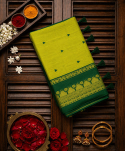 Mesmeric Green Cotton Silk Saree With Incomparable Blouse Piece