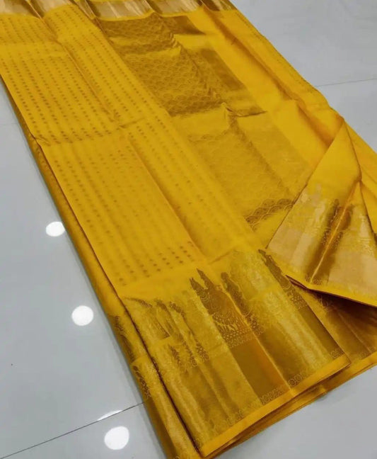 Snazzy Yellow Soft Silk Saree With Fugacious Blouse Piece