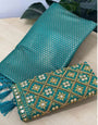 Magnetic Firozi Kanjivaram Silk Saree With Two Breathtaking Blouse Piece