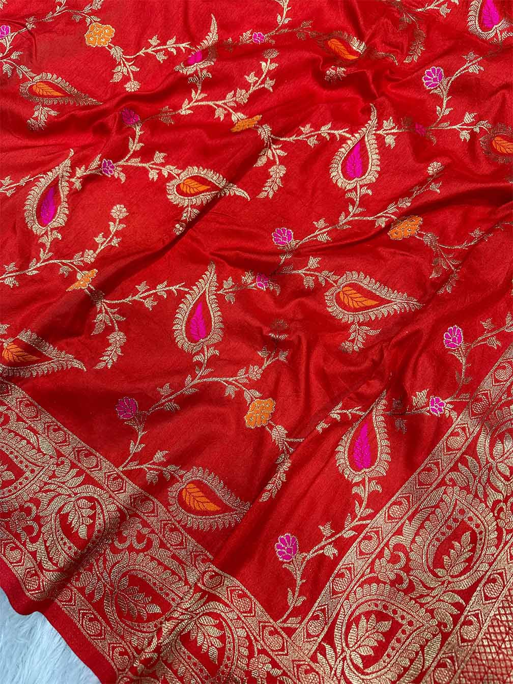 Cynosure Red Soft Banarasi Silk Saree With Exuberant Blouse Piece