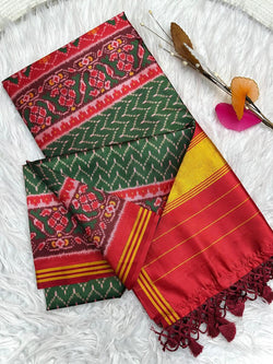 Energetic Dark Green Ikkat Printed Patola Silk Saree With Flattering Blouse Piece