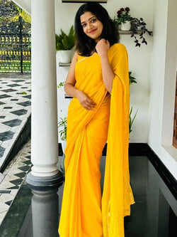 Prodigal Yellow Banarasi Georgette Silk Saree With Enchanting Blouse Piece