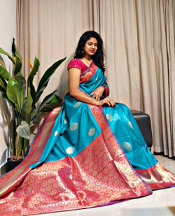 Rhapsody Firozi Soft Banarasi Silk Saree With Glamorous Blouse Piece