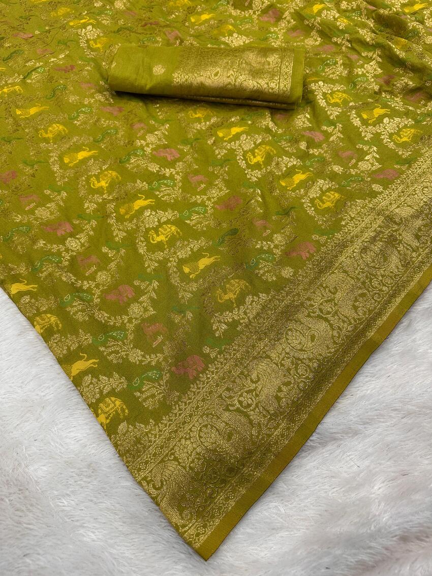 Magnetic Green Soft Banarasi Silk Saree With Twirling Blouse Piece