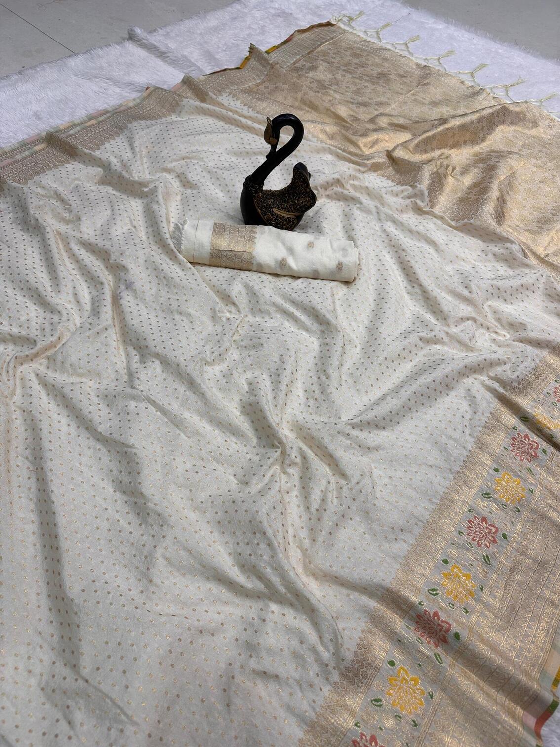 Stunner Off White Soft Banarasi Silk Saree With Prominent Blouse Piece