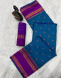 Efflorescence Teal Blue Soft Banarasi Silk Saree With Stunner Blouse Piece