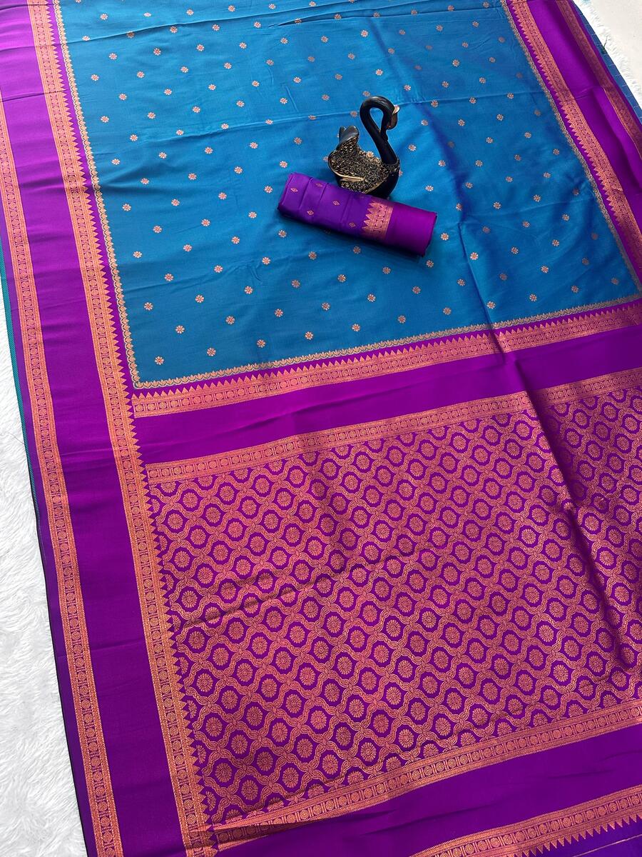 Efflorescence Teal Blue Soft Banarasi Silk Saree With Stunner Blouse Piece