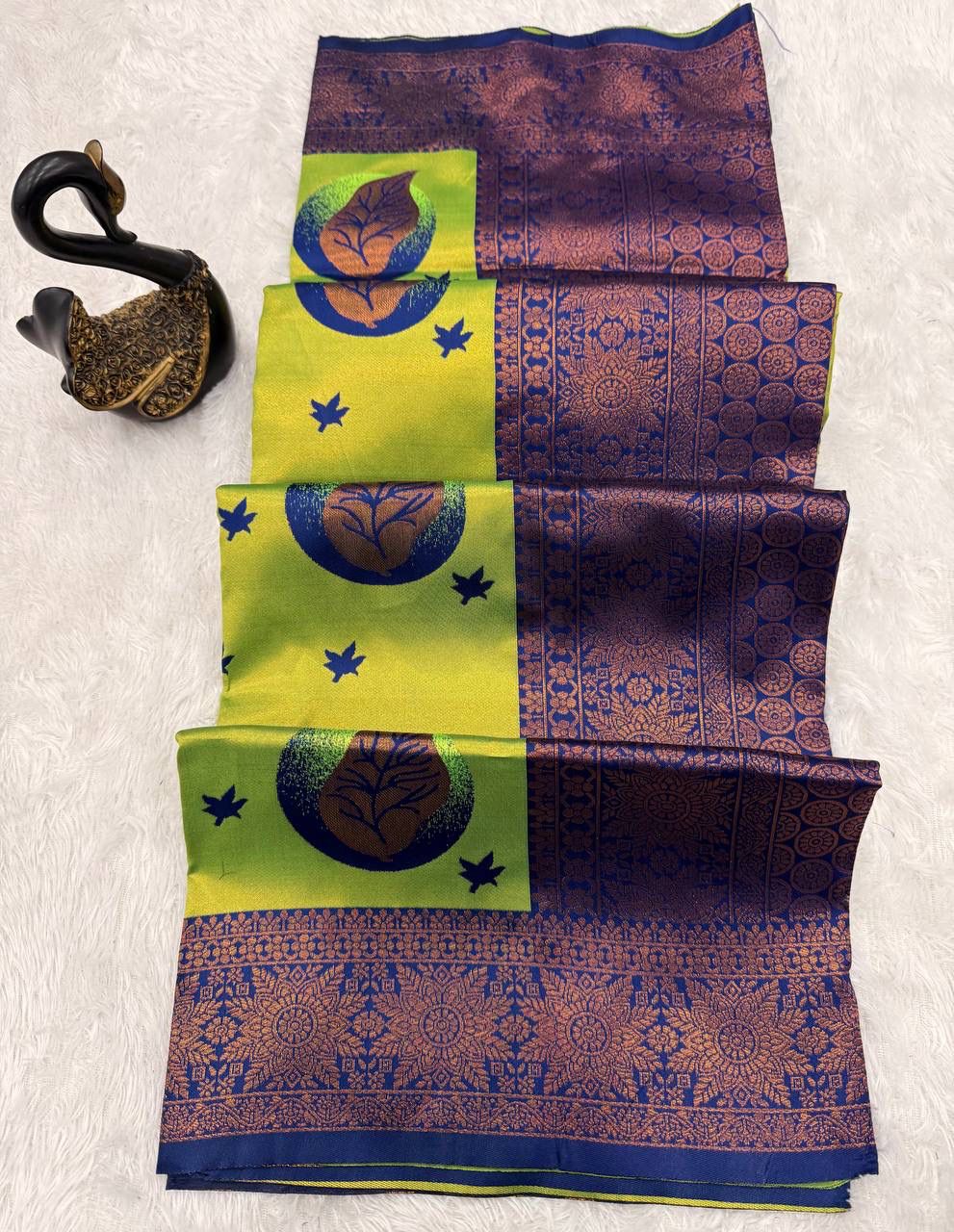 Tantalizing Parrot Soft Silk Saree With Assemblage Blouse Piece